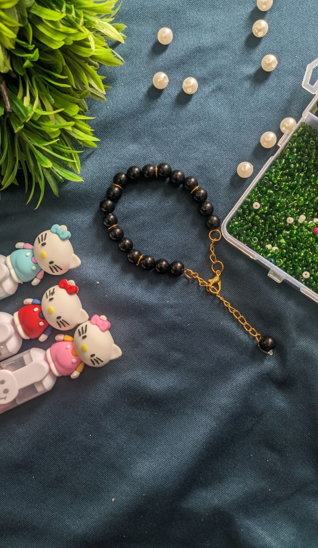 Elegant Black Stone Beaded Bracelet with Golden Chain Extension