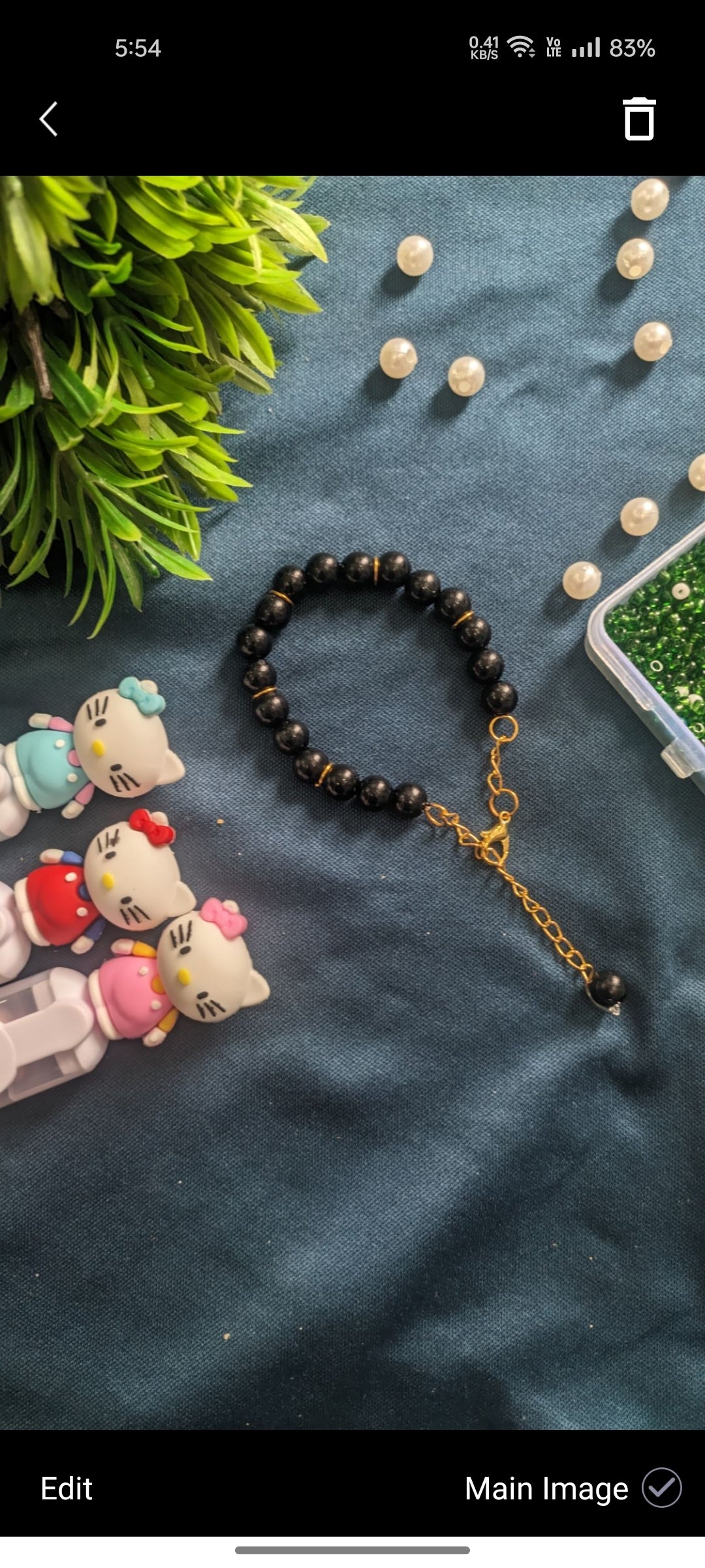 Elegant Black Stone Beaded Bracelet with Golden Chain Extension