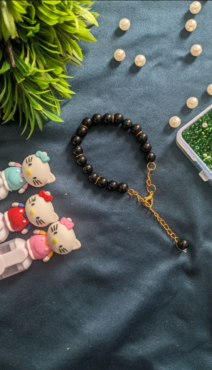 Elegant Black Stone Beaded Bracelet with Golden Chain Extension